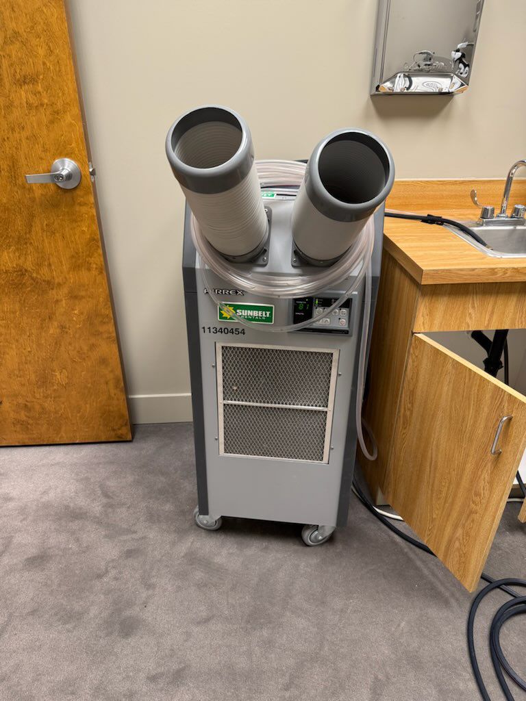 Portable spot cooling unit set up inside a commercial back room