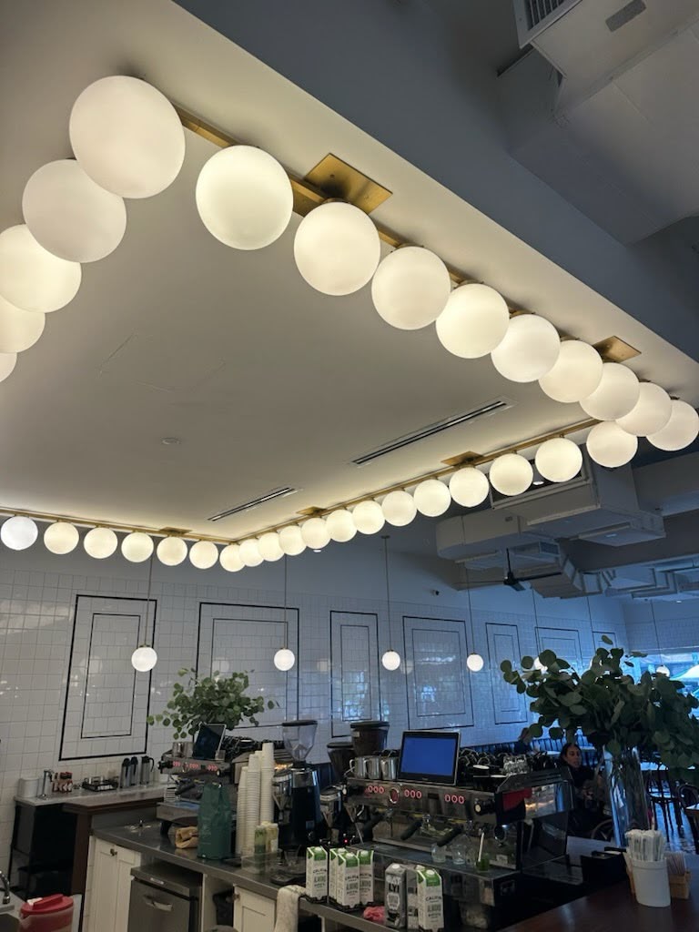 Globe lighting and ceiling systems inside a restaurant